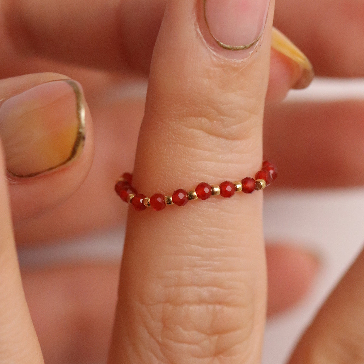 Stretchy Gemstone Ring featuring semi-precious gemstones and delicate sterling silver plated beads, offering a comfortable fit with a touch of refined elegance.