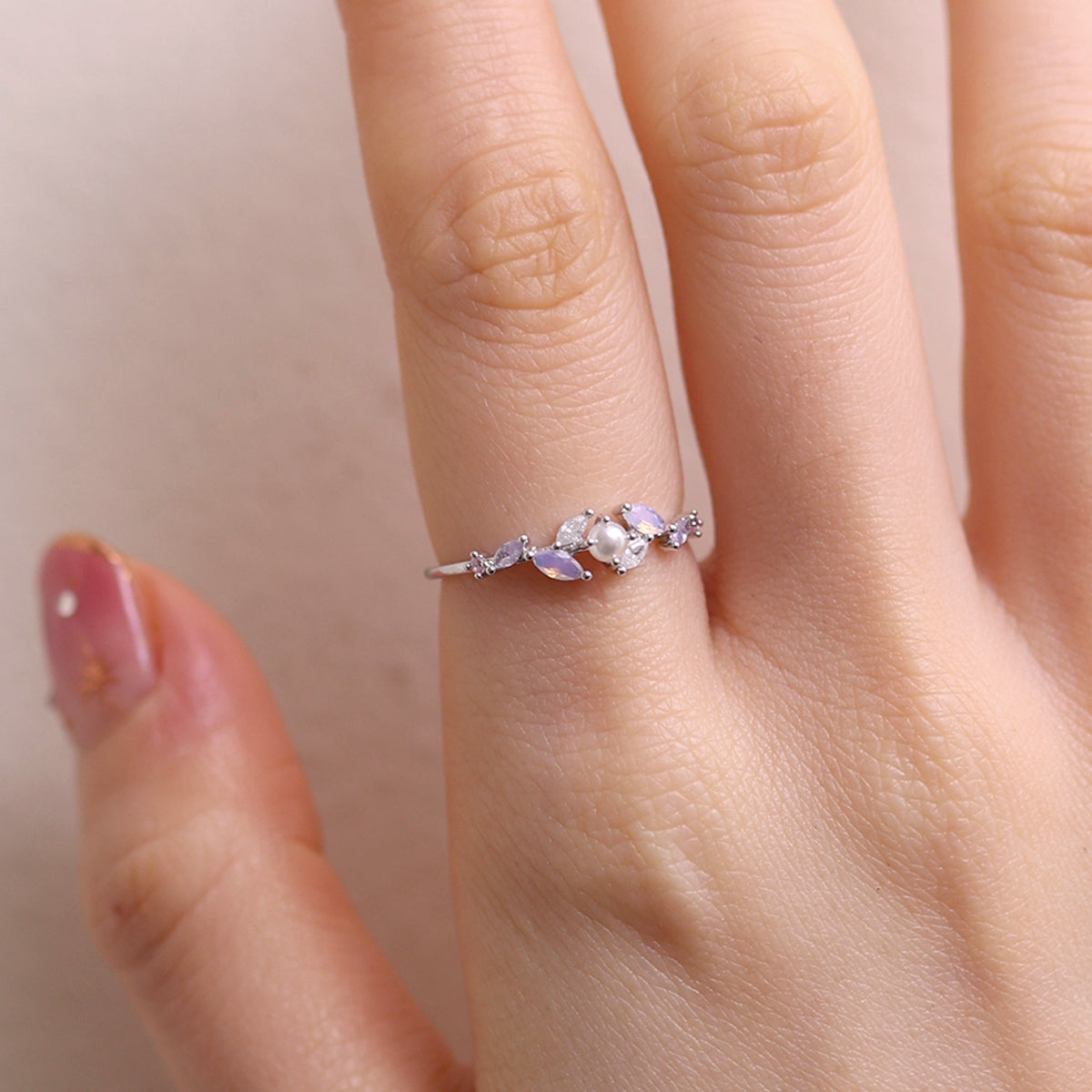 Moonstone Cubic Pearl Vine Ring featuring a delicate vine design with shimmering moonstone and lustrous cubic pearls, crafted for timeless elegance and sophistication.