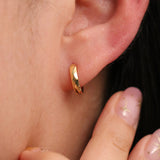 Hammered huggie earring