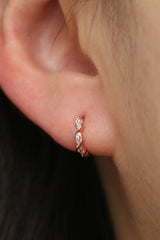 White topaz twirl huggie earrings
