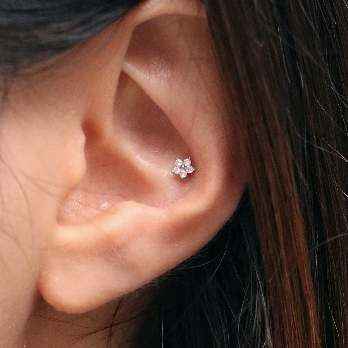 Teeny flower piercing