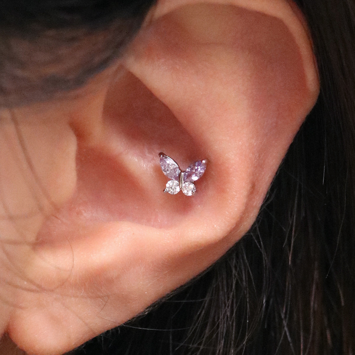 Purple butterfly piercing