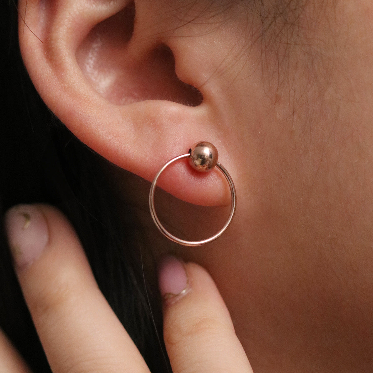 Ball with Line Circle Earrings featuring a modern geometric design with a delicate ball and sleek line detail, offering minimalist elegance and everyday versatility.