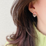 Cubic oval huggie earrings